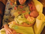 Mom resting with twins