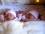Twins sharing Crib