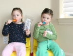 Addi and Cassi Holding Zavesca packets 